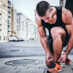 Home Gym Benefits - man tying his shoes