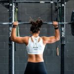 Gym Mirror - woman doing weight lifting