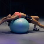 Workout Nutrition - woman doing yoga on stability ball
