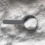 Protein Powder - black magnifying glass on white and brown marble table