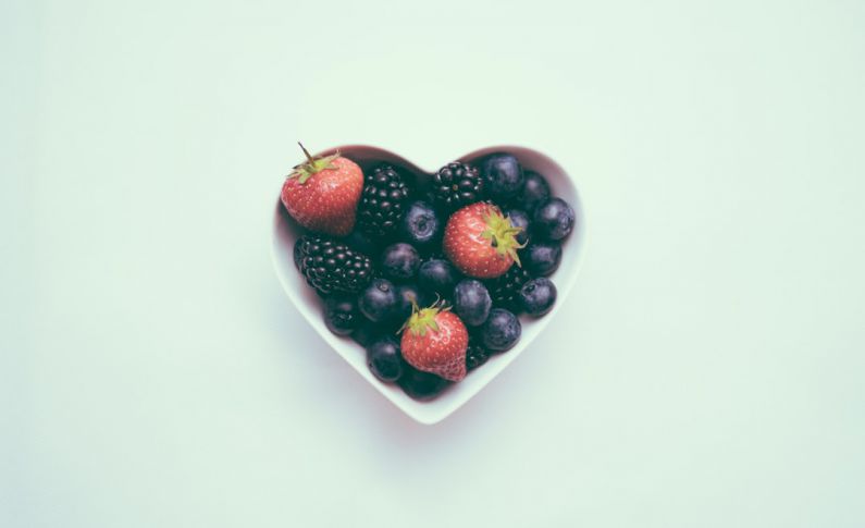 Nutrition Myths - heart-shaped bowl with strawberries