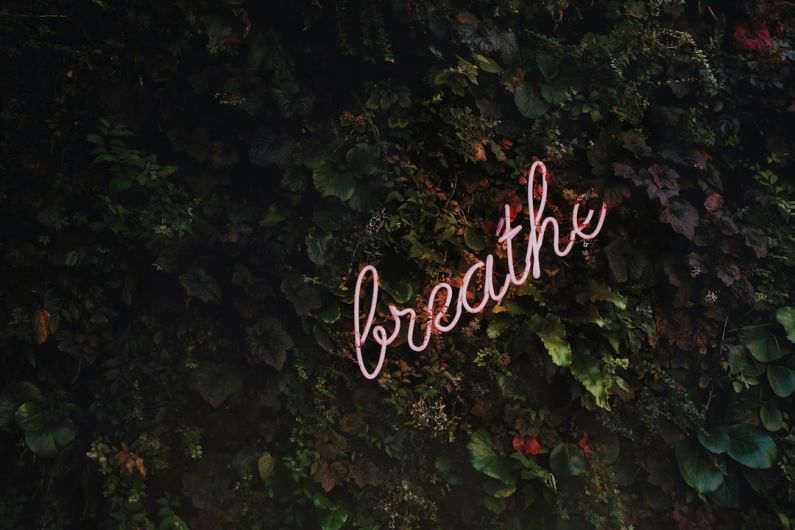 Yoga Routine - Breathe neon signage
