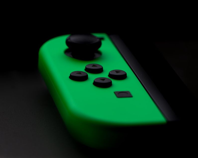 Breath Control - close-up photography of Nintendo Switch neon green controller