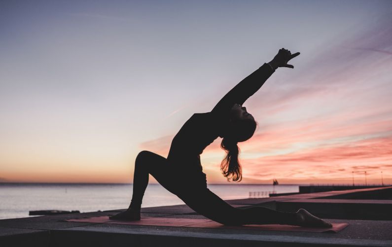 Yoga Strength - silhouette photography of woman doing yoga