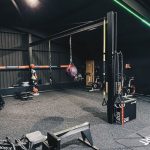 Pilates Equipment - a gym filled with different types of exercise equipment
